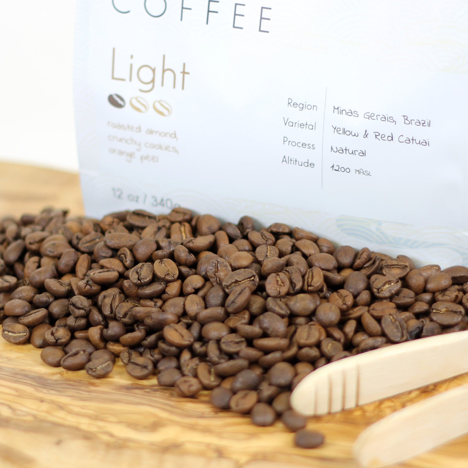 Gabé Coffee - Light Roast Whole Bean Coffee - Close-up of Gabe Coffee light roast beans showcasing their light brown hue.