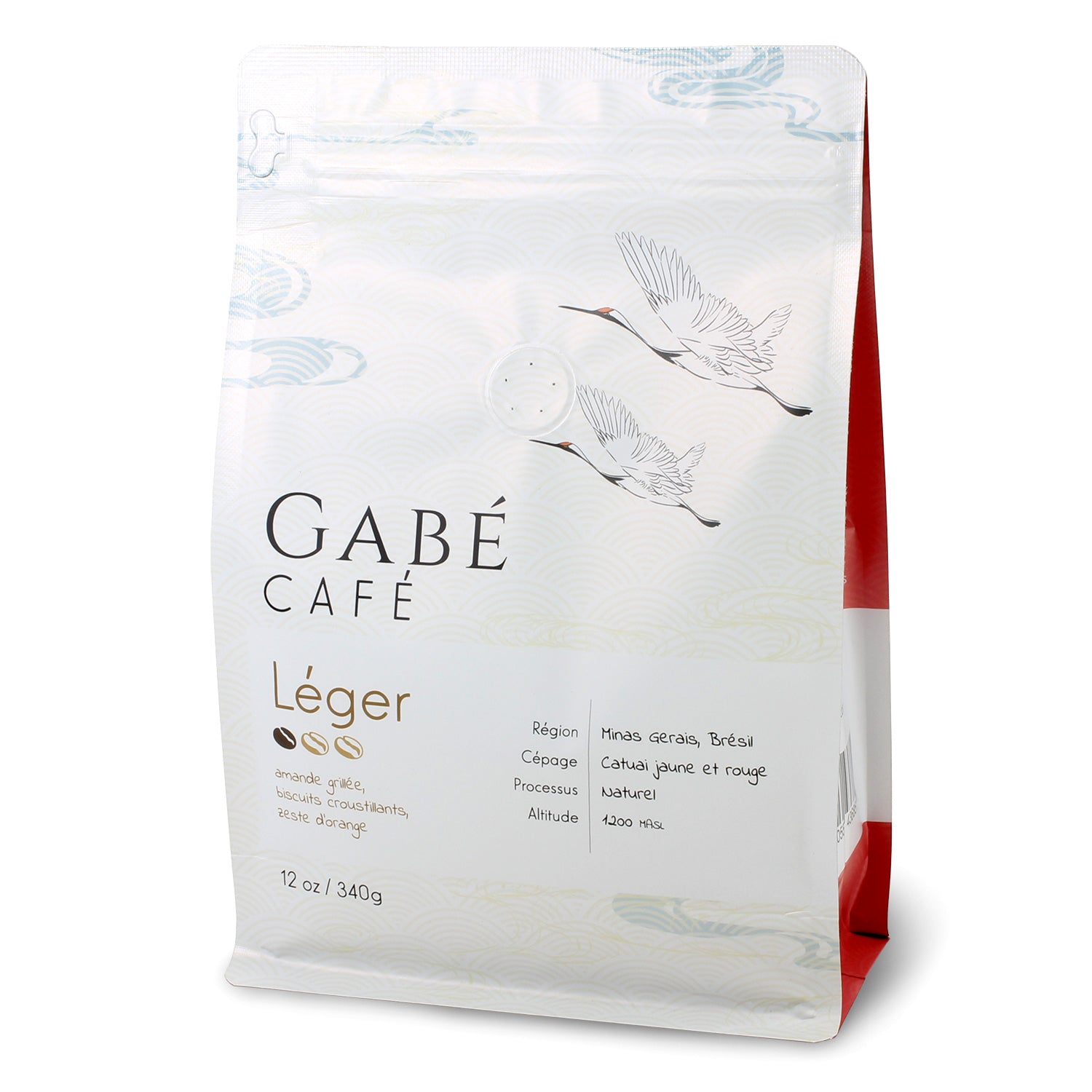 Gabé Coffee - Light Roast Whole Bean Coffee - Gabe Coffee's light roast beans alongside a steaming cup of black coffee.